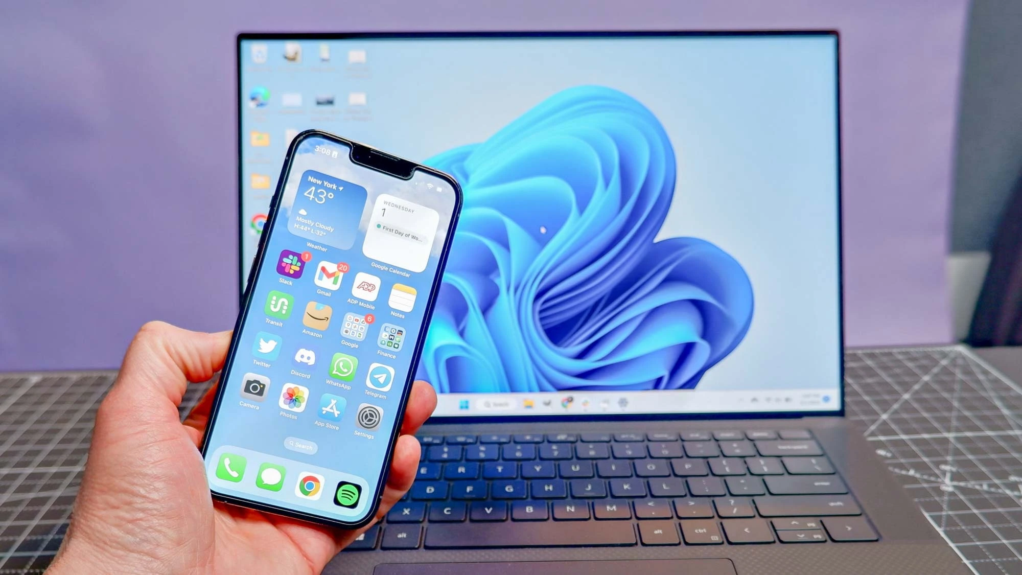 Windows PC and smartphone connected via Phone Link for calls, messages, and photos